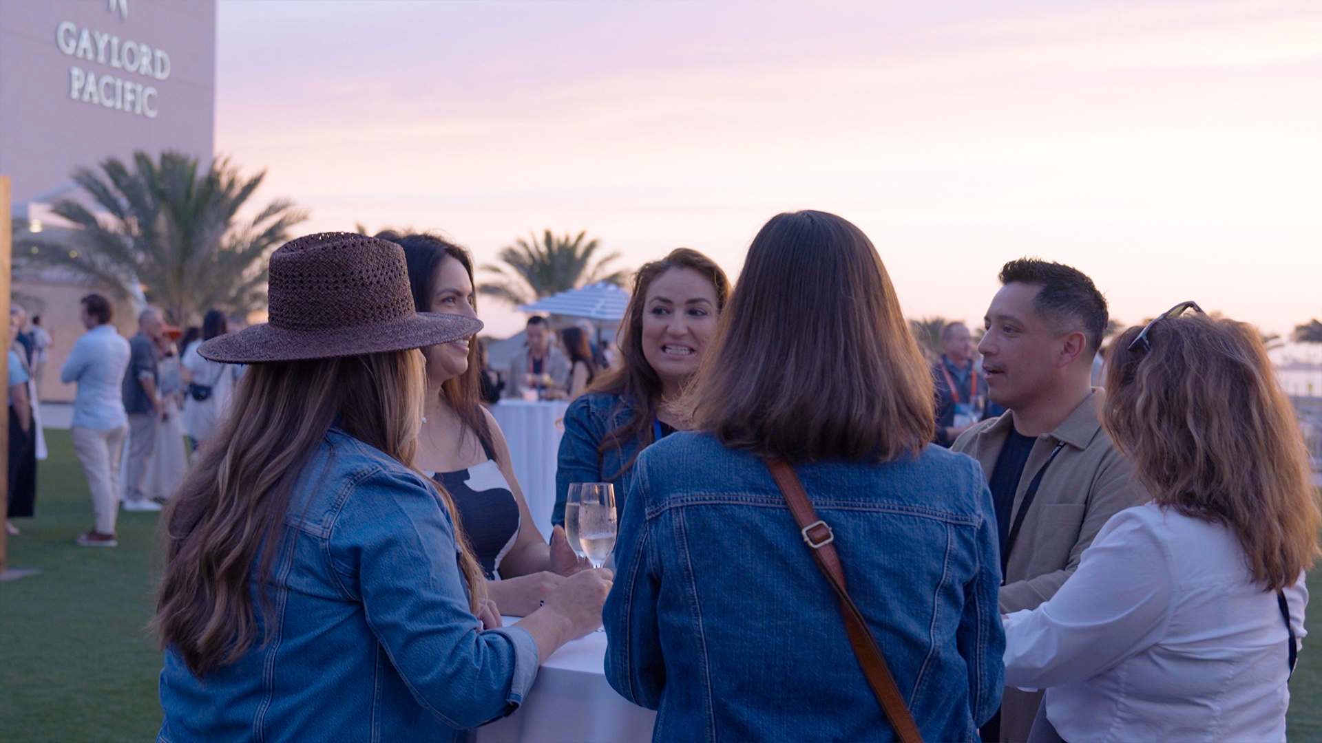 Conference guests gathering at an outdoor mixer